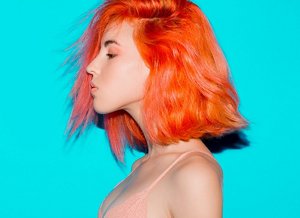 Girl with bright coral hair 